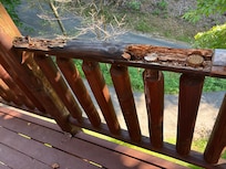 Railing outside of main entrance. High up.