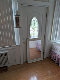 The front door that was blocked off with a mirror on the floor in the front bedroom.