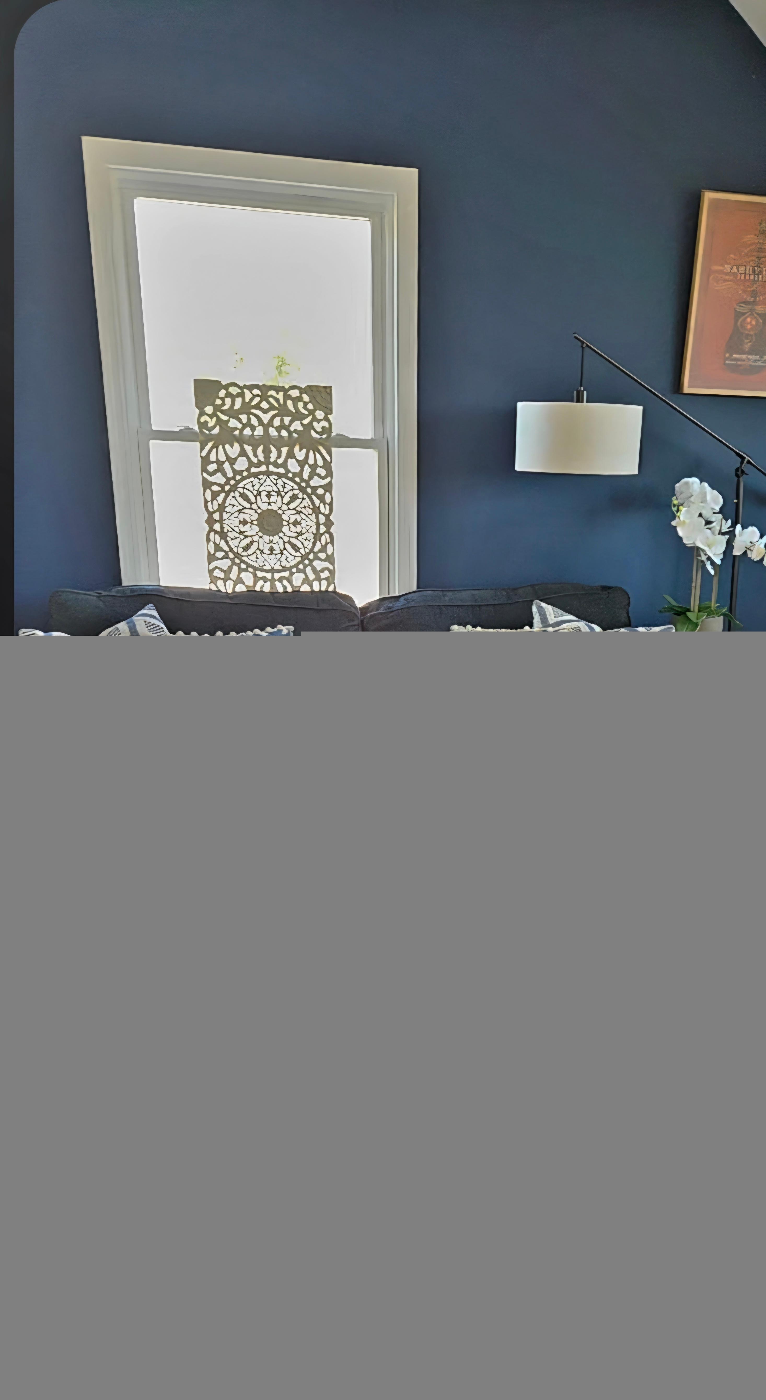 Living room with large TV mounted on wall