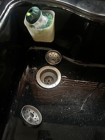 Sink clogged with food bits