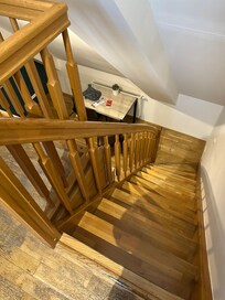 Stairs leading down to kitchen from bedroom