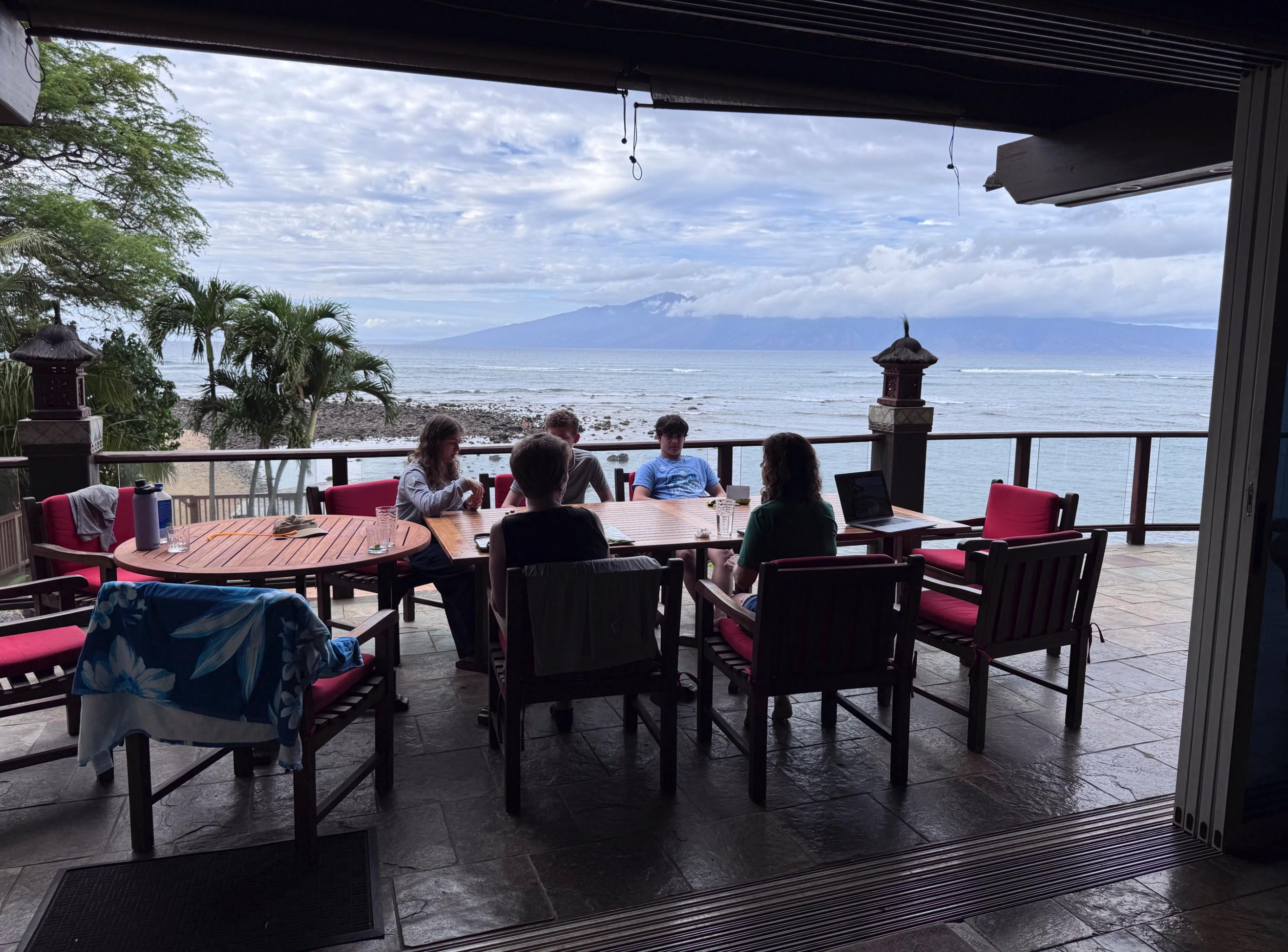 Table seating for our family of 11 together on the balcony as well as the inside dining area