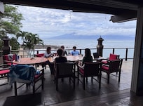 Table seating for our family of 11 together on the balcony as well as the inside dining area