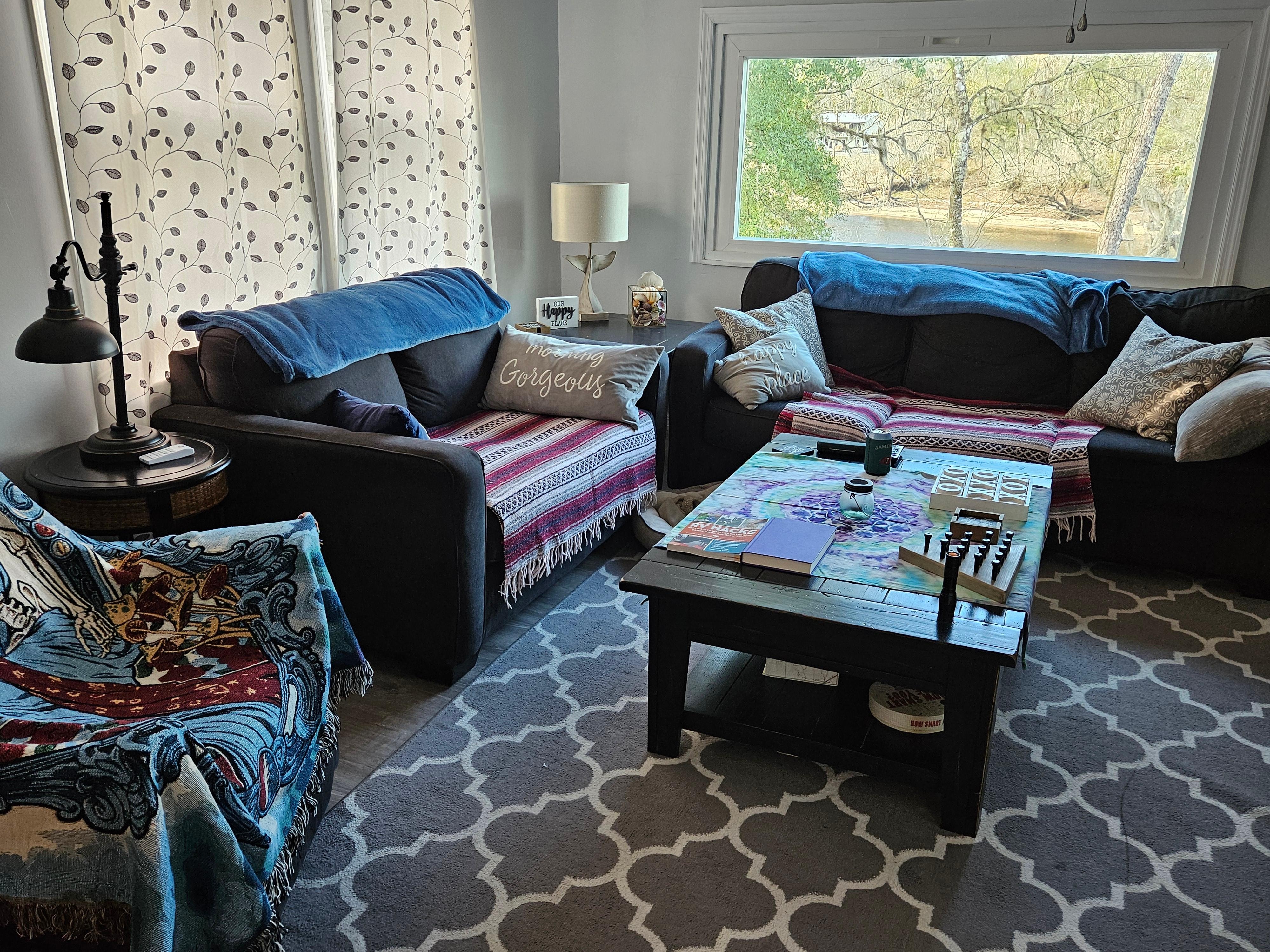 New living from part of deck enclosed. That picture window needs bamboo blinds or some for West setting sun