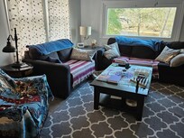 New living from part of deck enclosed. That picture window needs bamboo blinds or some for West setting sun