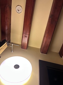 Shows bottom half of what appears to be old smoke/CO alarm.