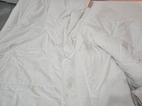 Lots of dirty blankets with makeup, blood and yellow stains.