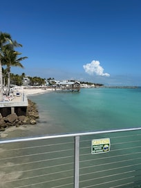 Private pier for lounging under large umbrellas or fishing.