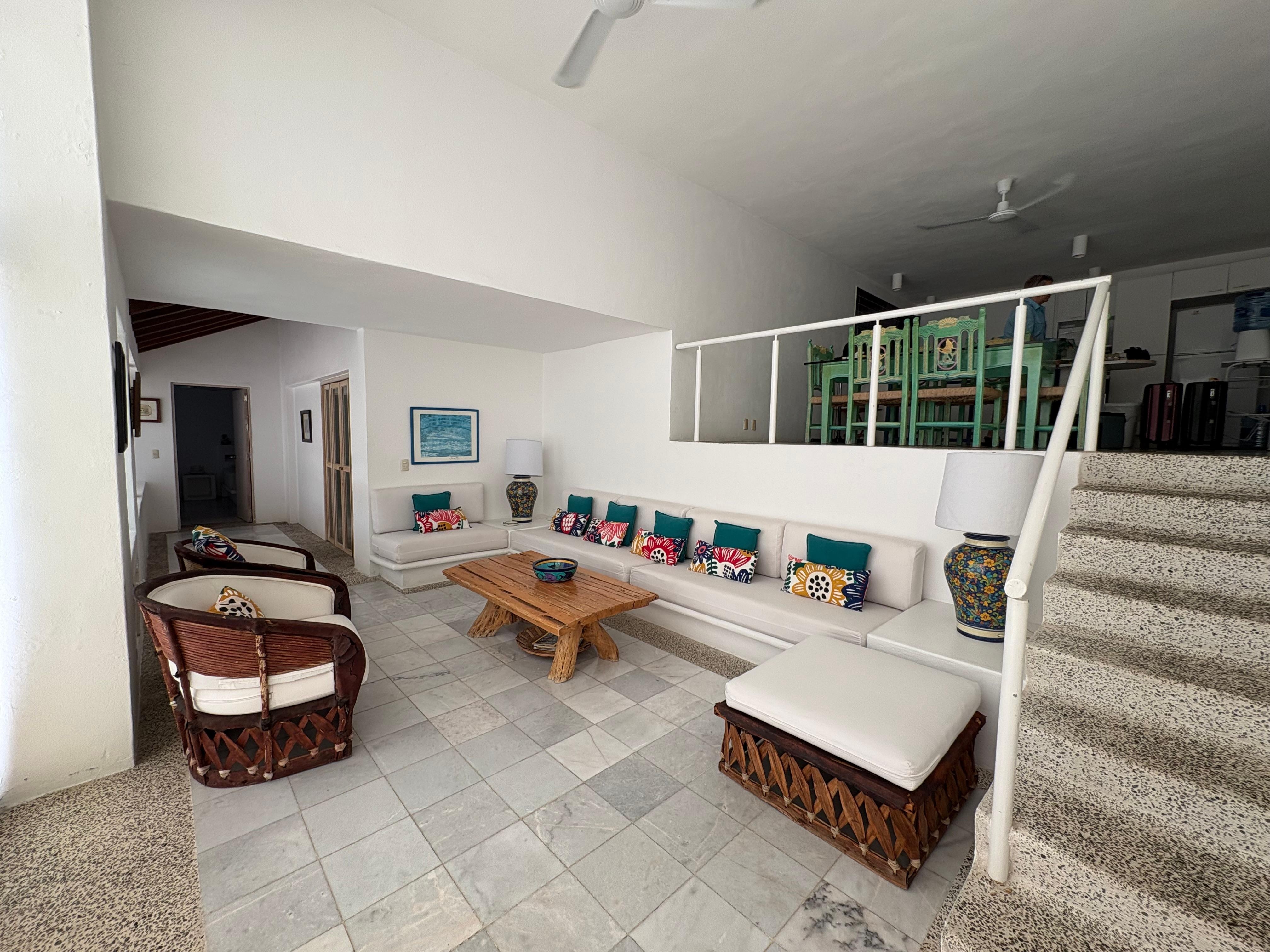 Living area with kitchen up the stairs