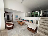 Living area with kitchen up the stairs