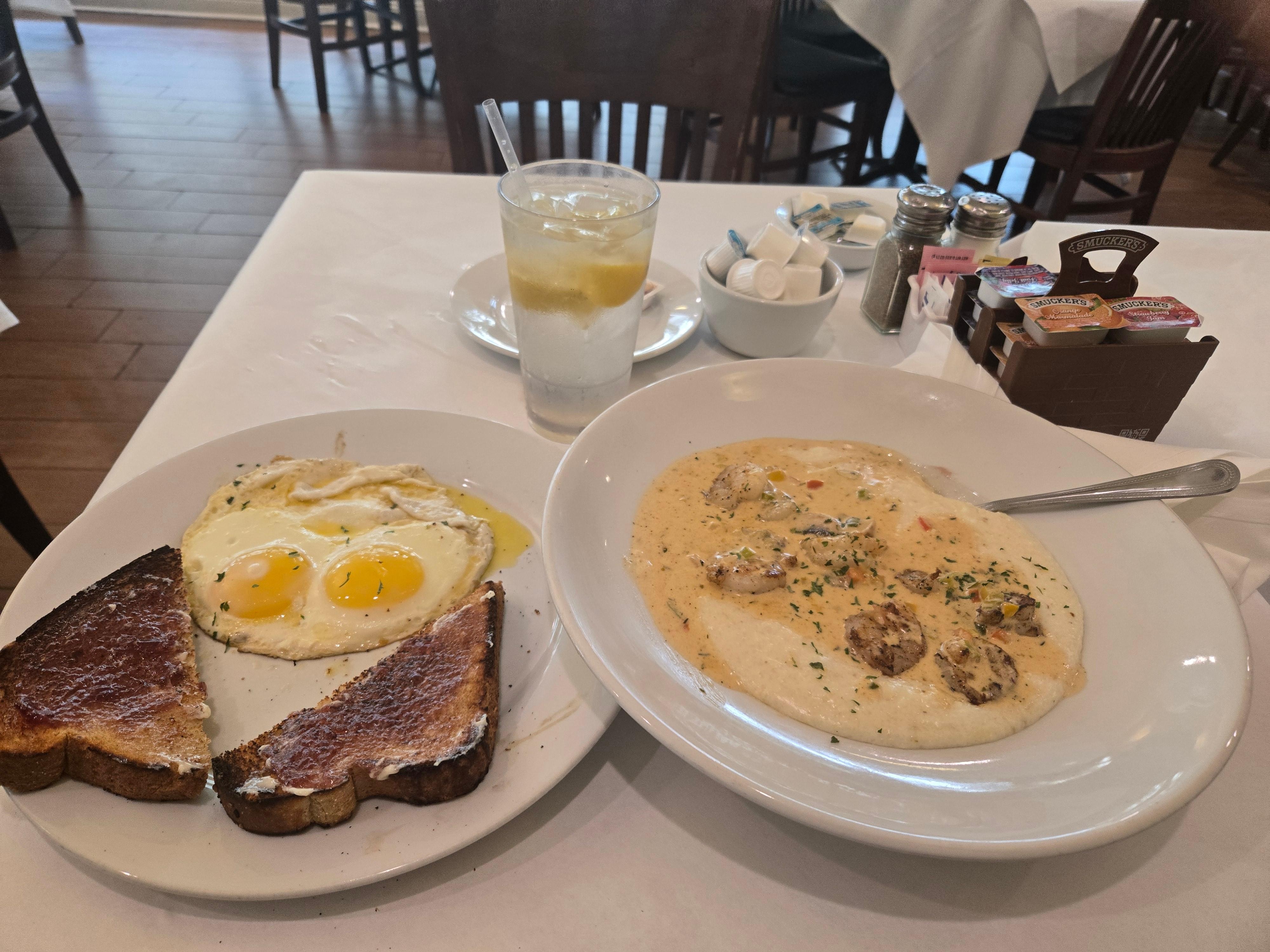 Eggs Sunny Side Up, Wheat Toast With Shirp & Grits..And A Ice Cold Glass Of Freshly Squeezed Lemon Water..😋
