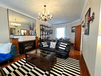 Dining table in the back with extra seating and high chair