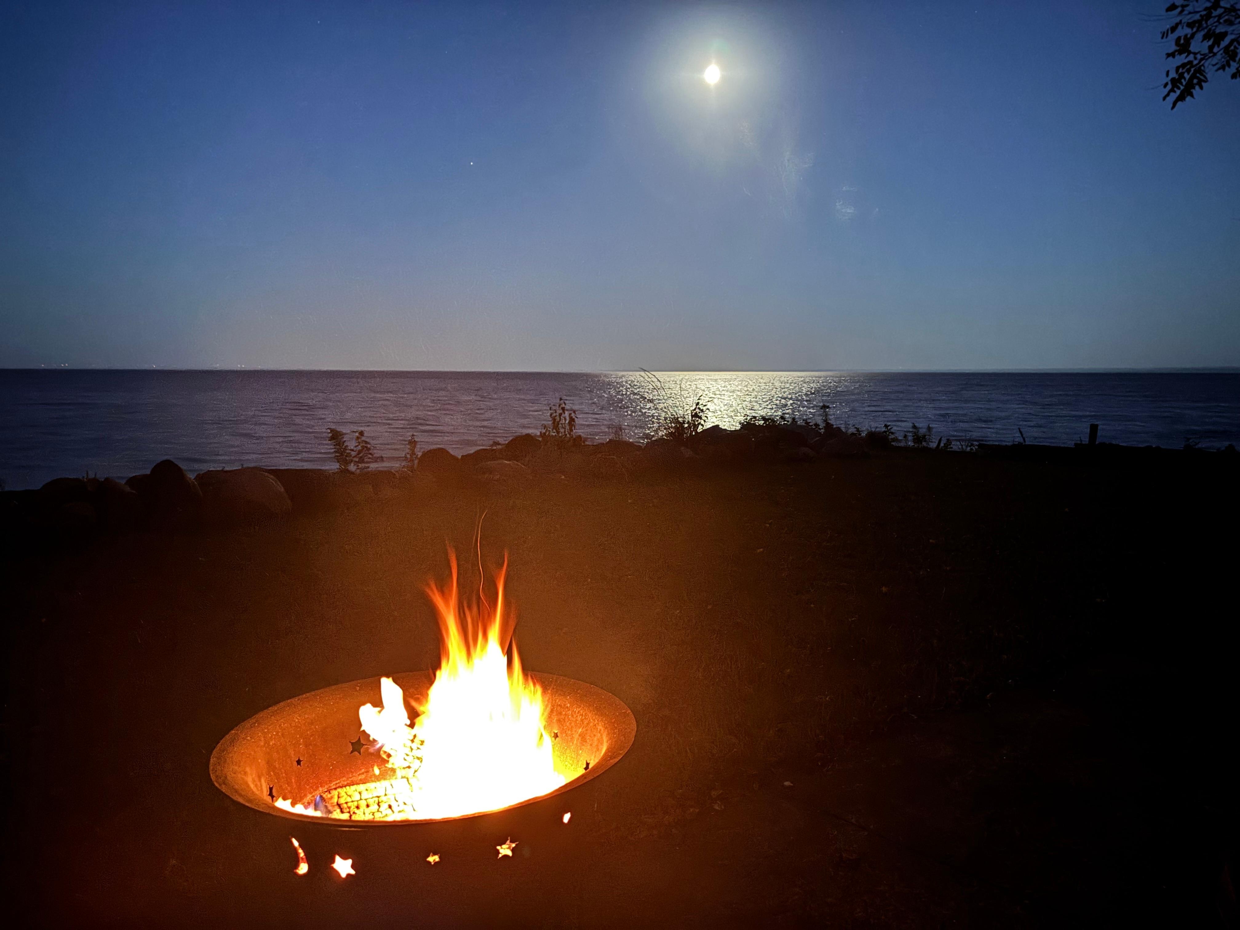 Moonlit lake beyond the fire pit