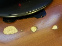 damaged furniture under tv