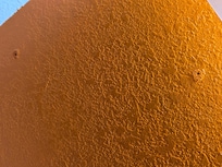 Exposed screws in wall