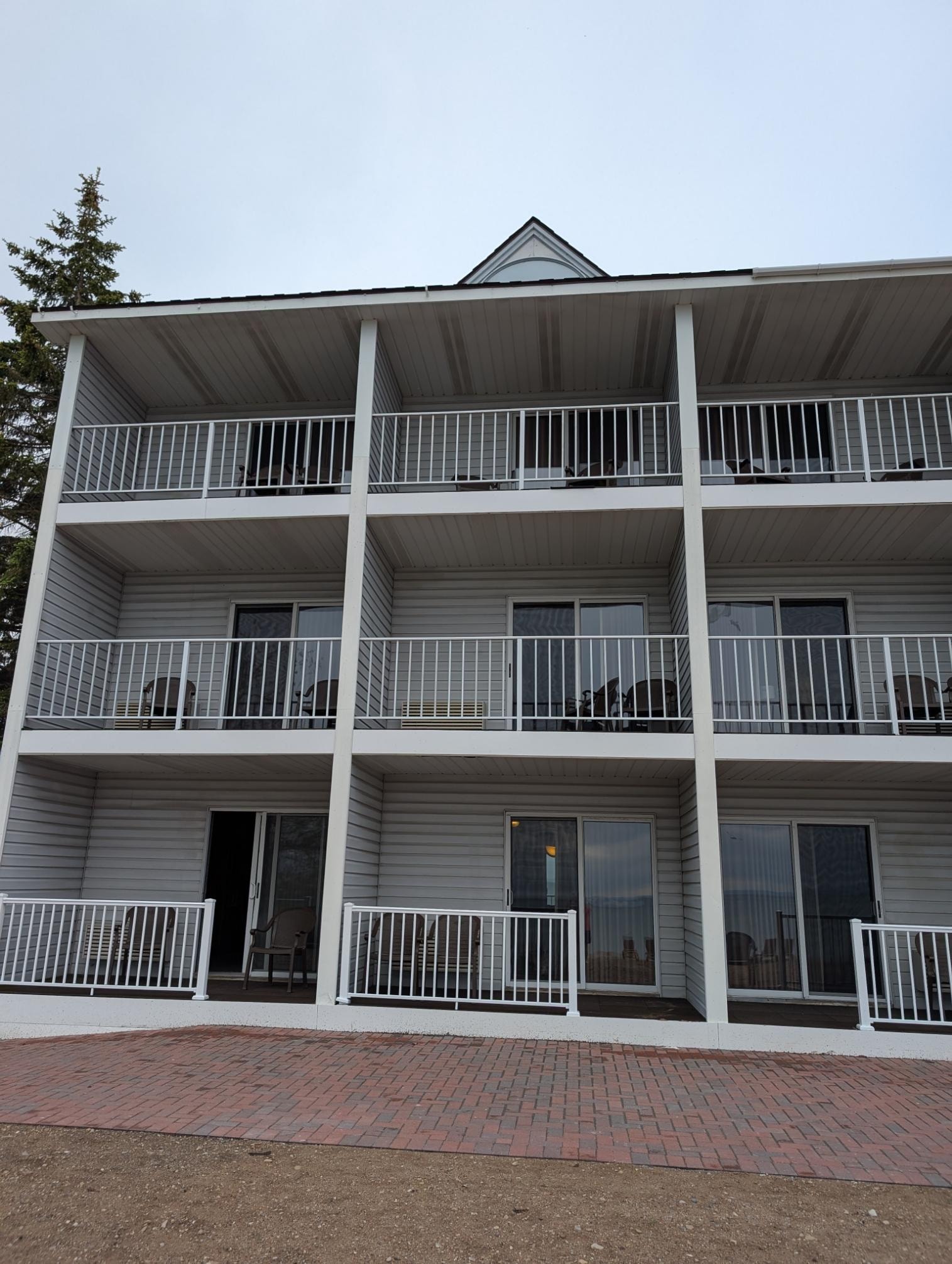 Our room #107 bottom left. Missing roof gutter above.