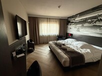 Room is wide, bed-making is perfect.