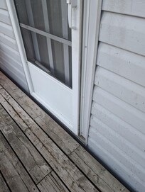 Screen door does not close, many live and dead insects caught between screen door and main door