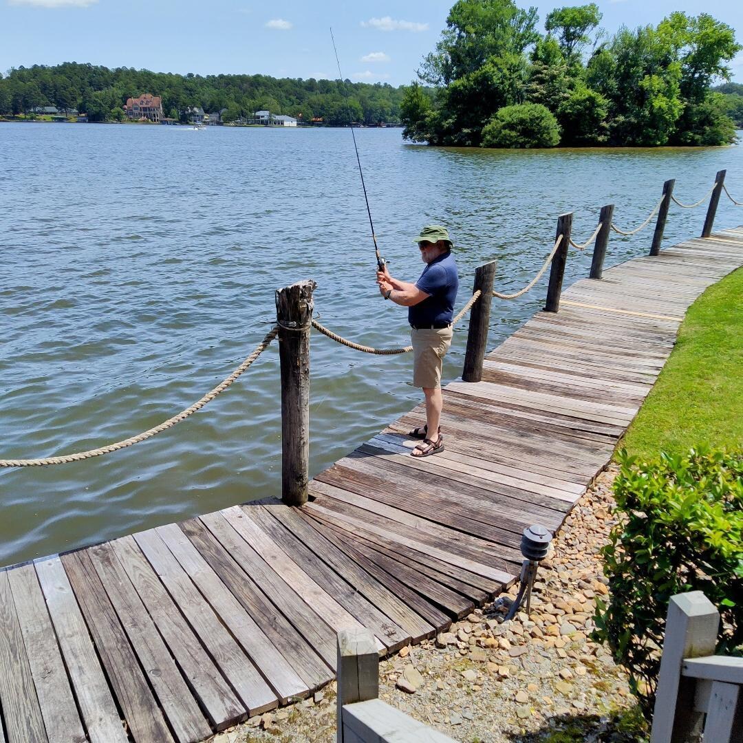 Fishing from the boardwalk that runs by at the foot of our deck steps.
