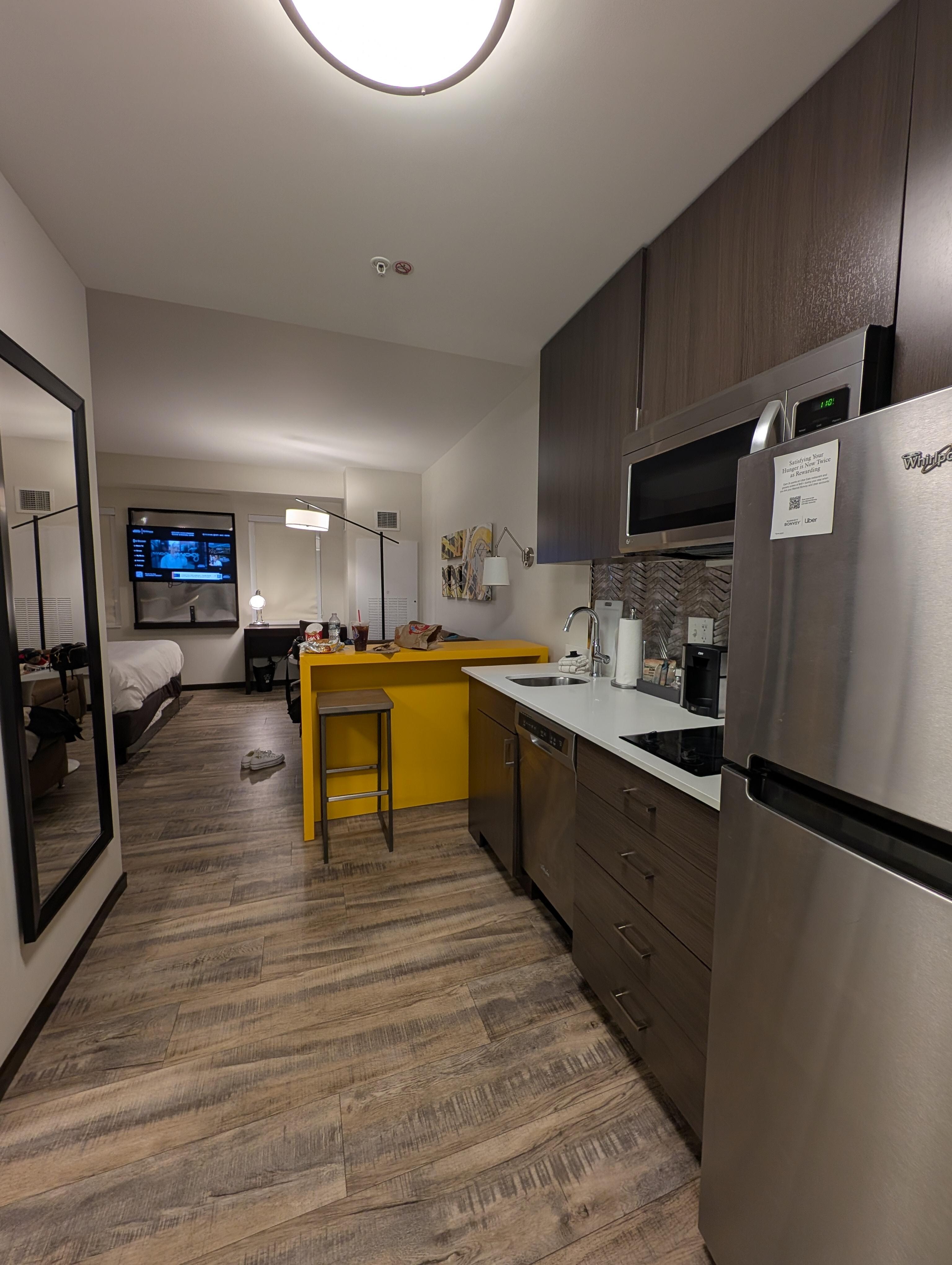 View of kitchen area across from the bathroom and next to the exit.