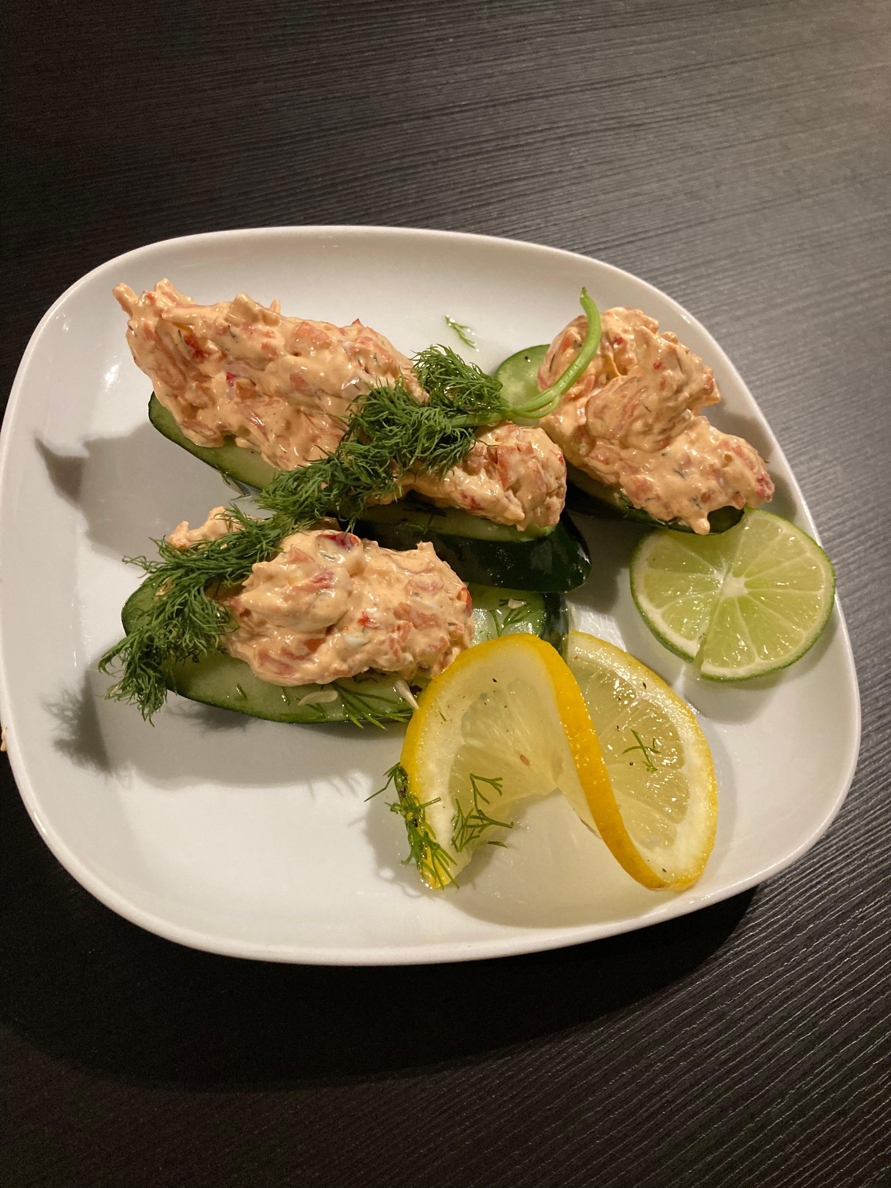 Salmon mousse on cucumber with dill