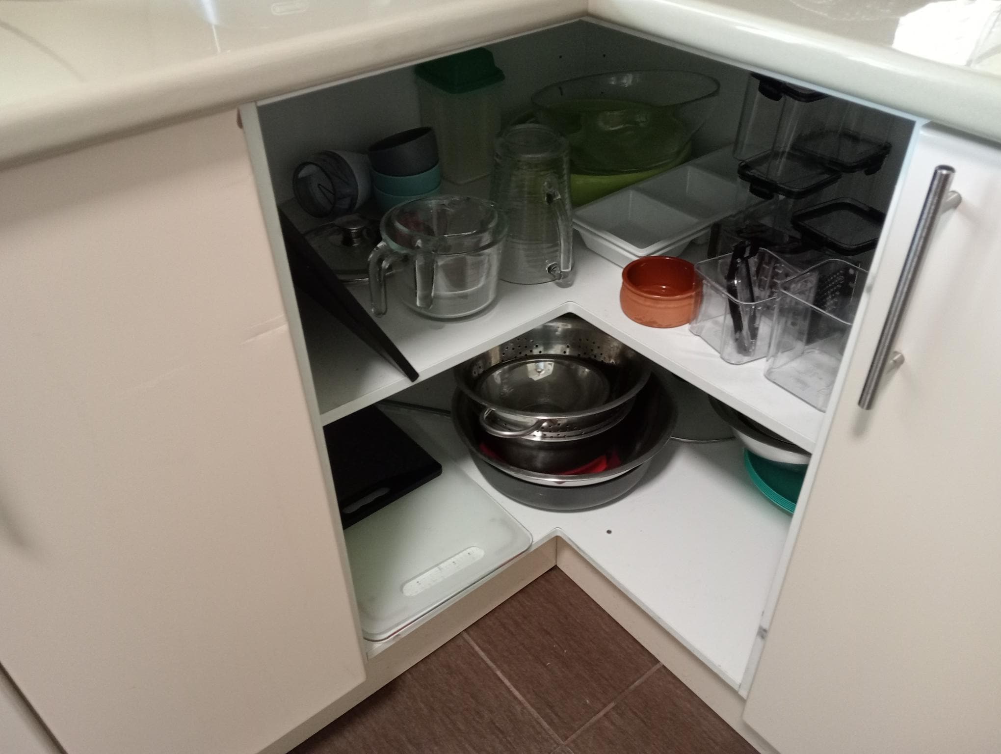 Open cupboard no doors. I did see a cockroach running in there