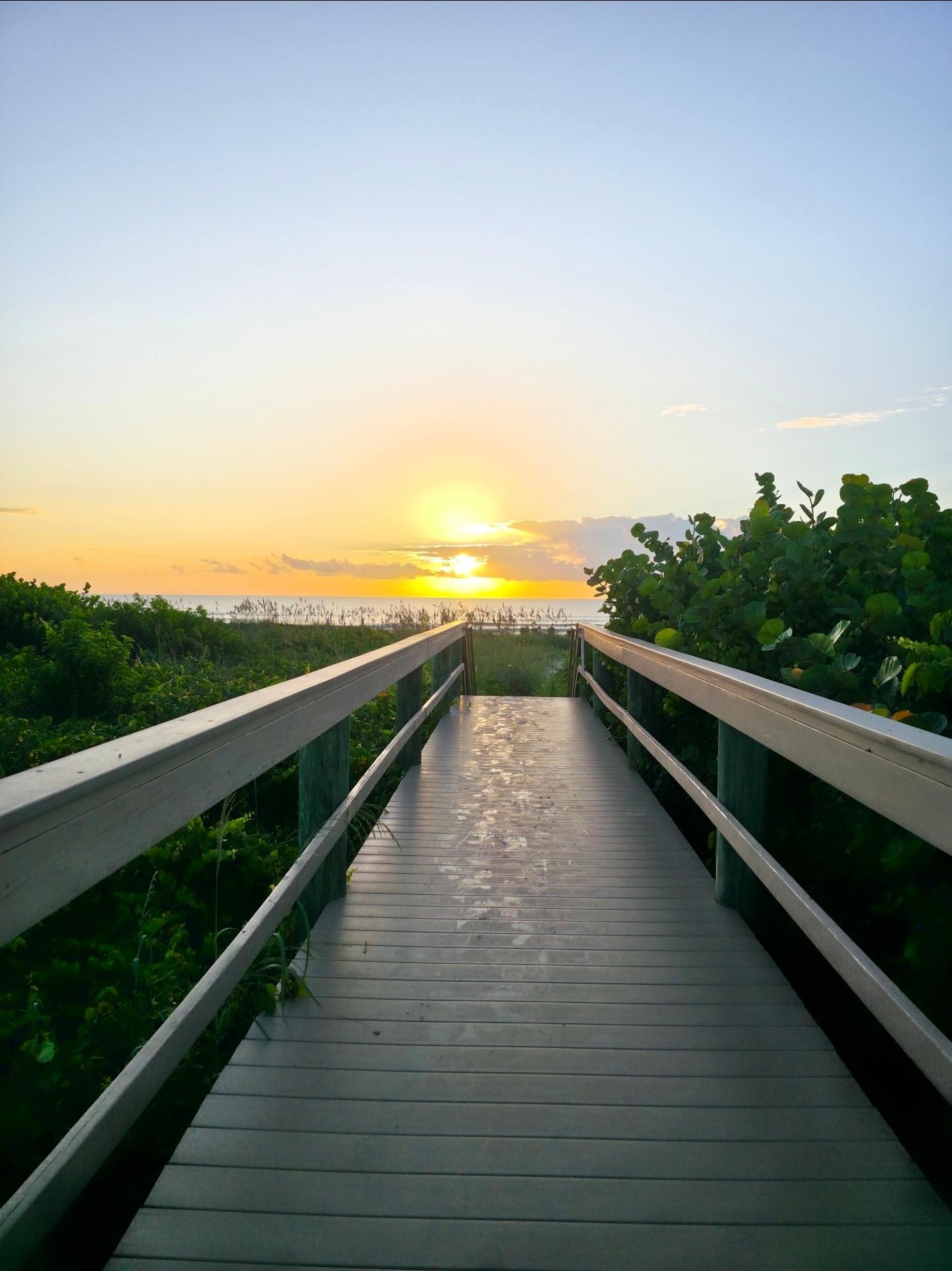 After gate, bridge to beach
