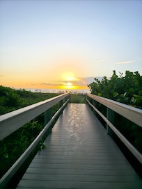 After gate, bridge to beach
