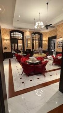 Breakfast / dining room. Probably 20ft ceilings