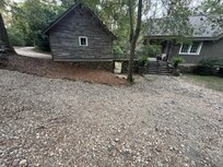 Front exterior with circle drive.