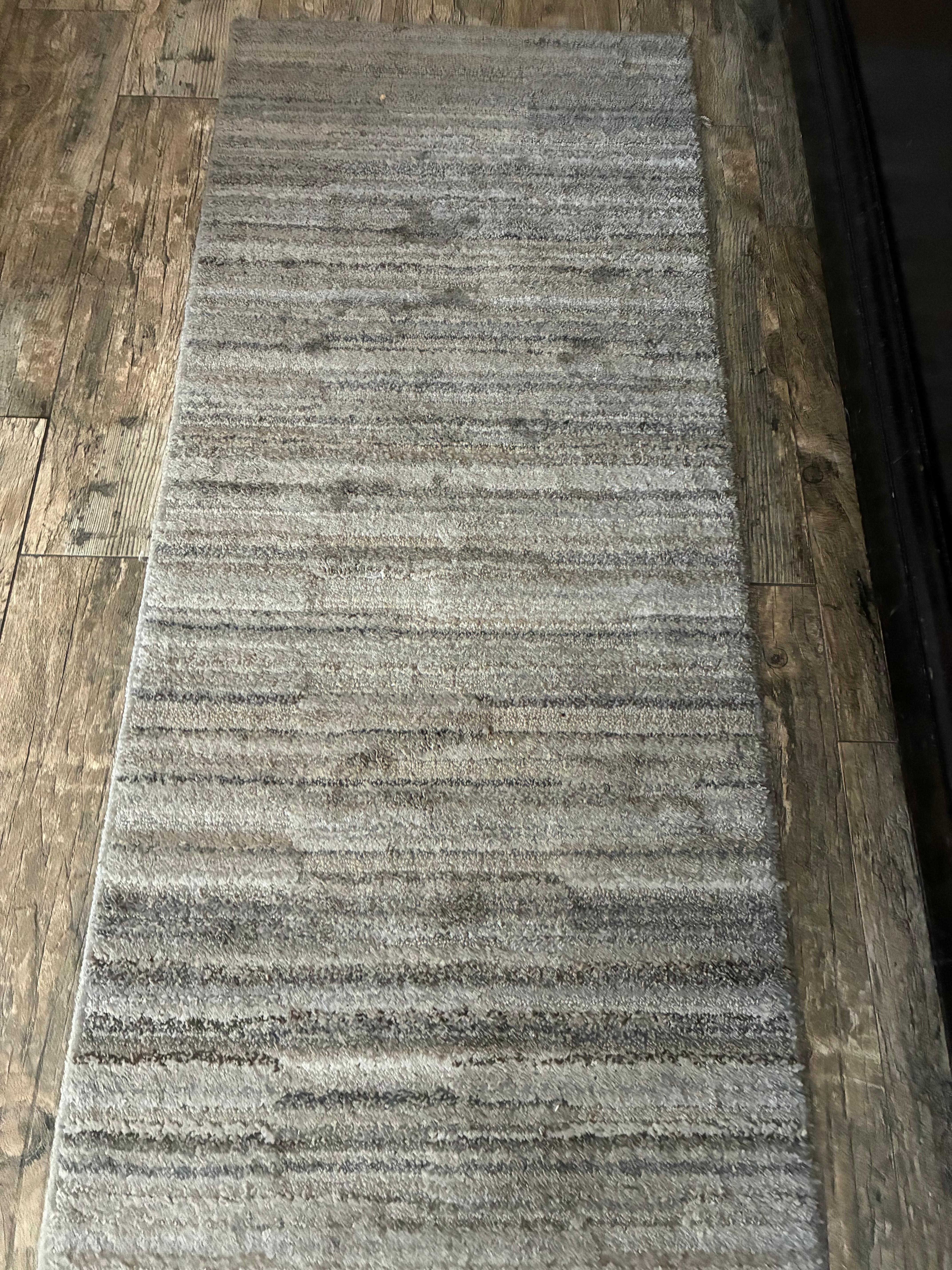 Another dirty and stained area rug 