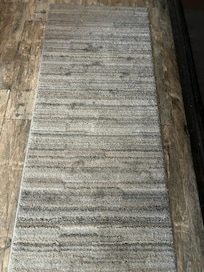 Another dirty and stained area rug