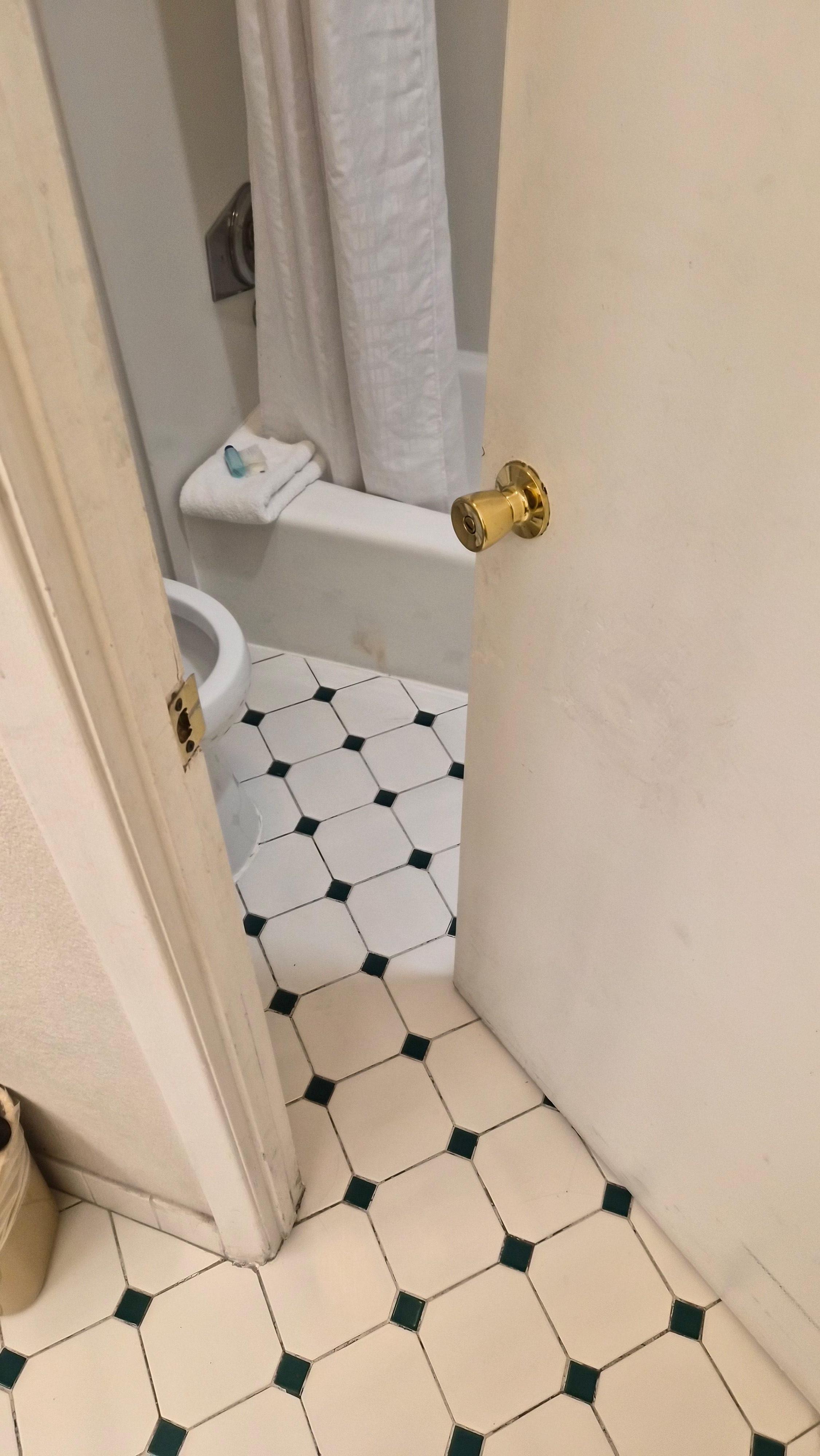 Bathroom door that didn't open any more than that because of heaved floor