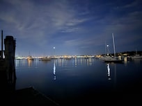 Moon over the harbor at Sail Newport dock waiting for pickup from water taxi