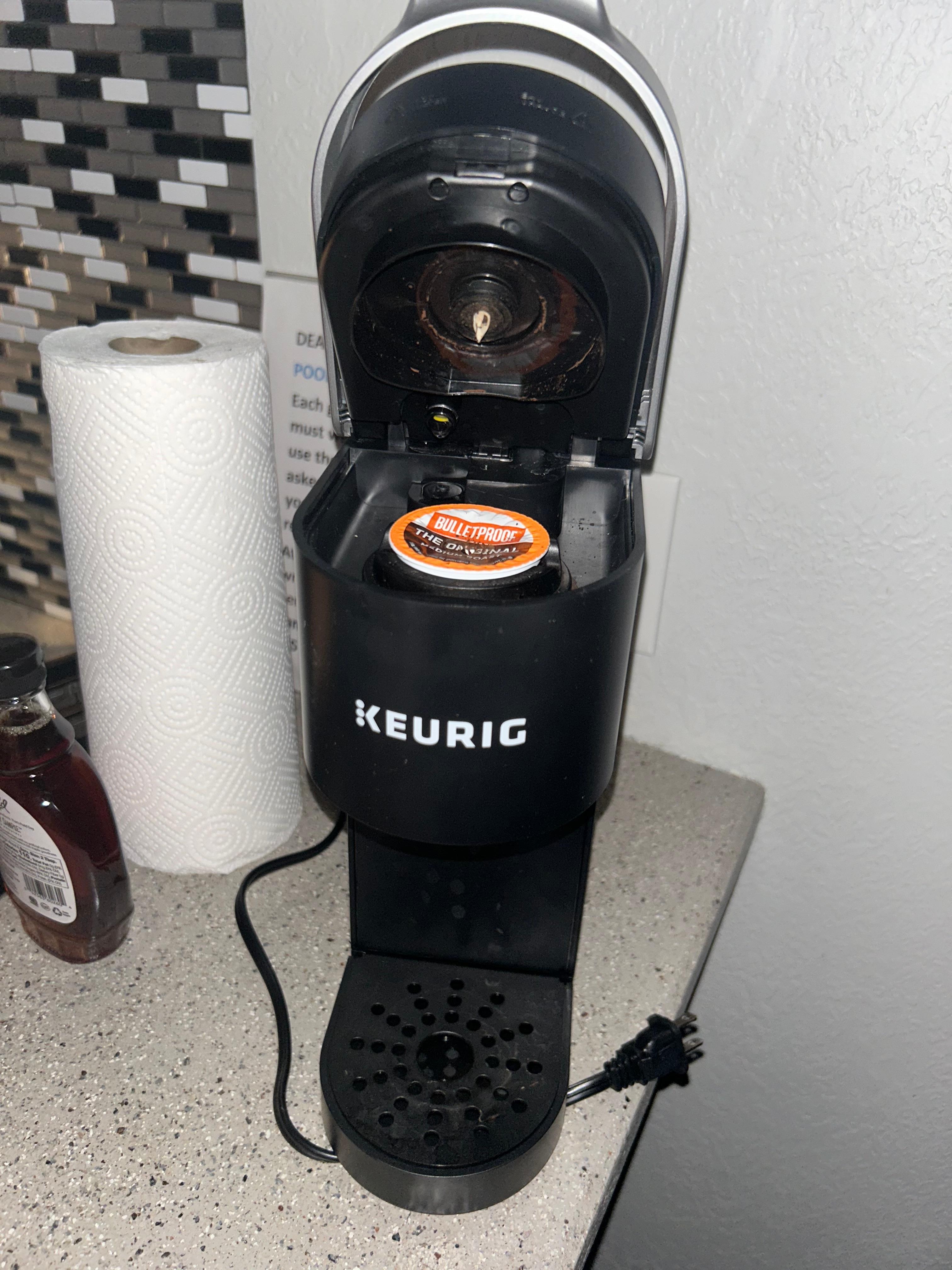 Broken Keurig with water still filling the drip tray