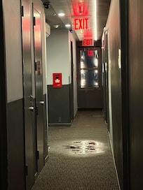 Pipe burst in hallway. No staff around or no staff to call to fix / get the alarms turned off.