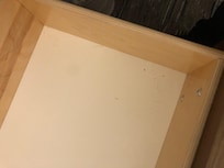 Dog hair and crumbs in drawer