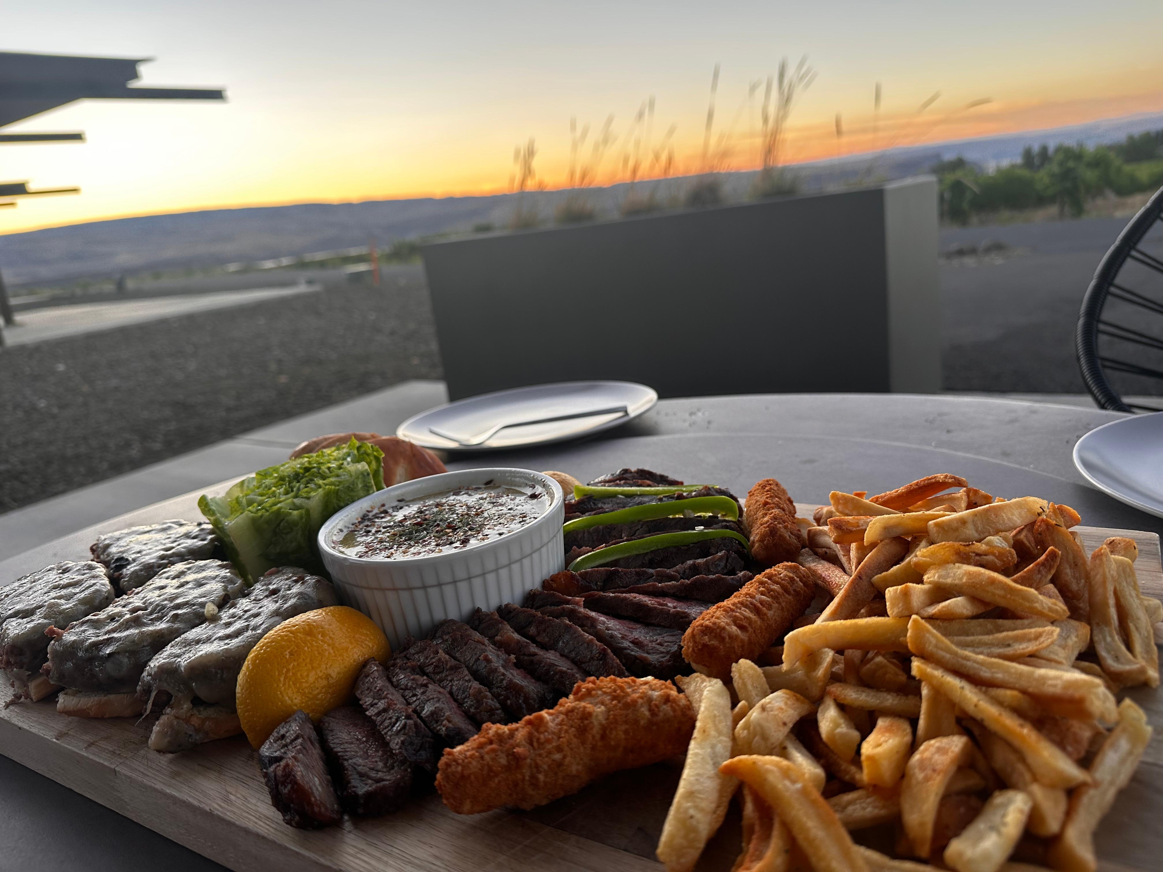 Front porch dinner cooked/grilled at the residence! 