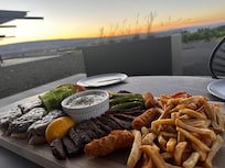 Front porch dinner cooked/grilled at the residence!