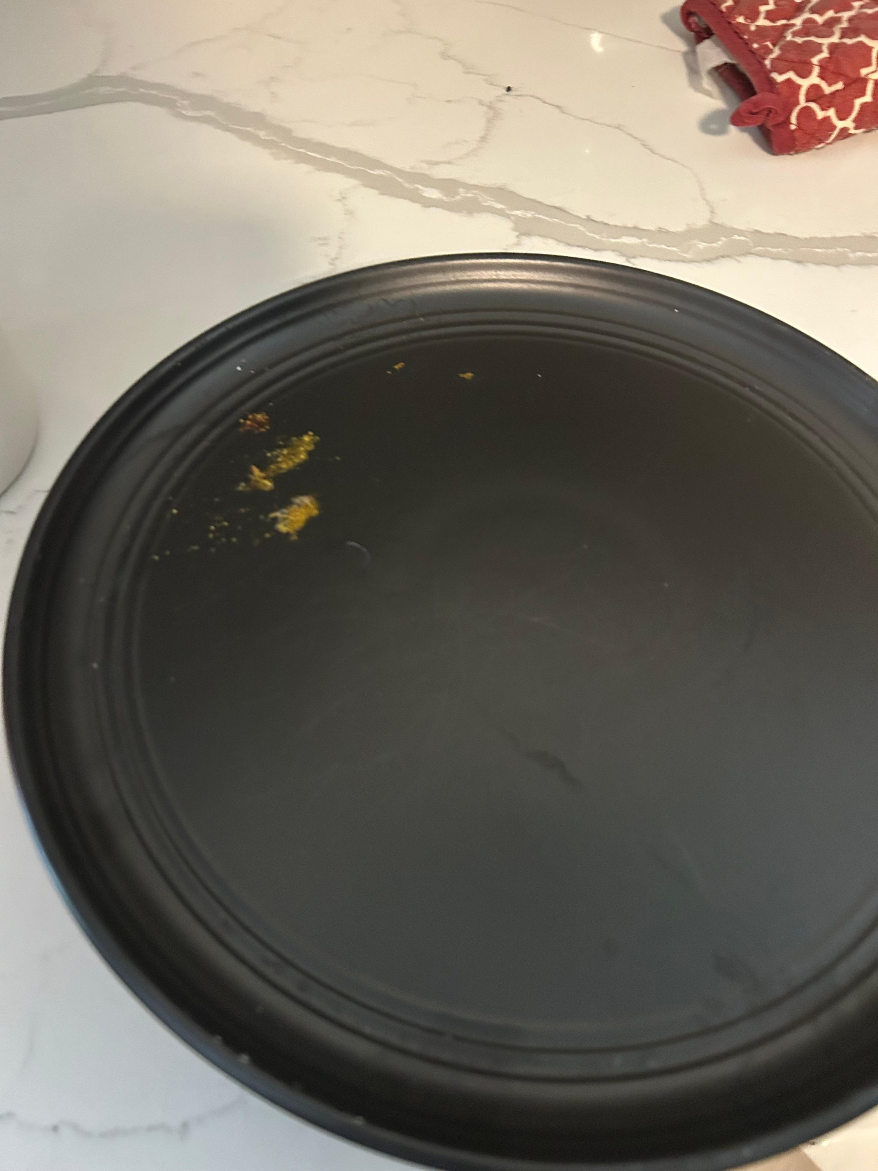 Another disgusting dish found in the cabinet with dried food stuck to it. 