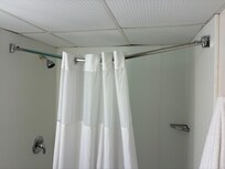 Shower rod nearly fell down, very loose curved rod, not safe