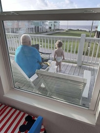 Watching the pelicans float on top of the ocean waves with papa