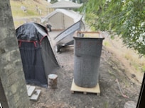 Neighbors toileting area just feet from the bedroom windows