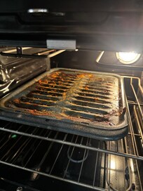 Dirty oven tray from previous guests