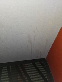 Wall with spilled liquid on it.