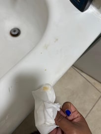 Poop on toilet and bathtub