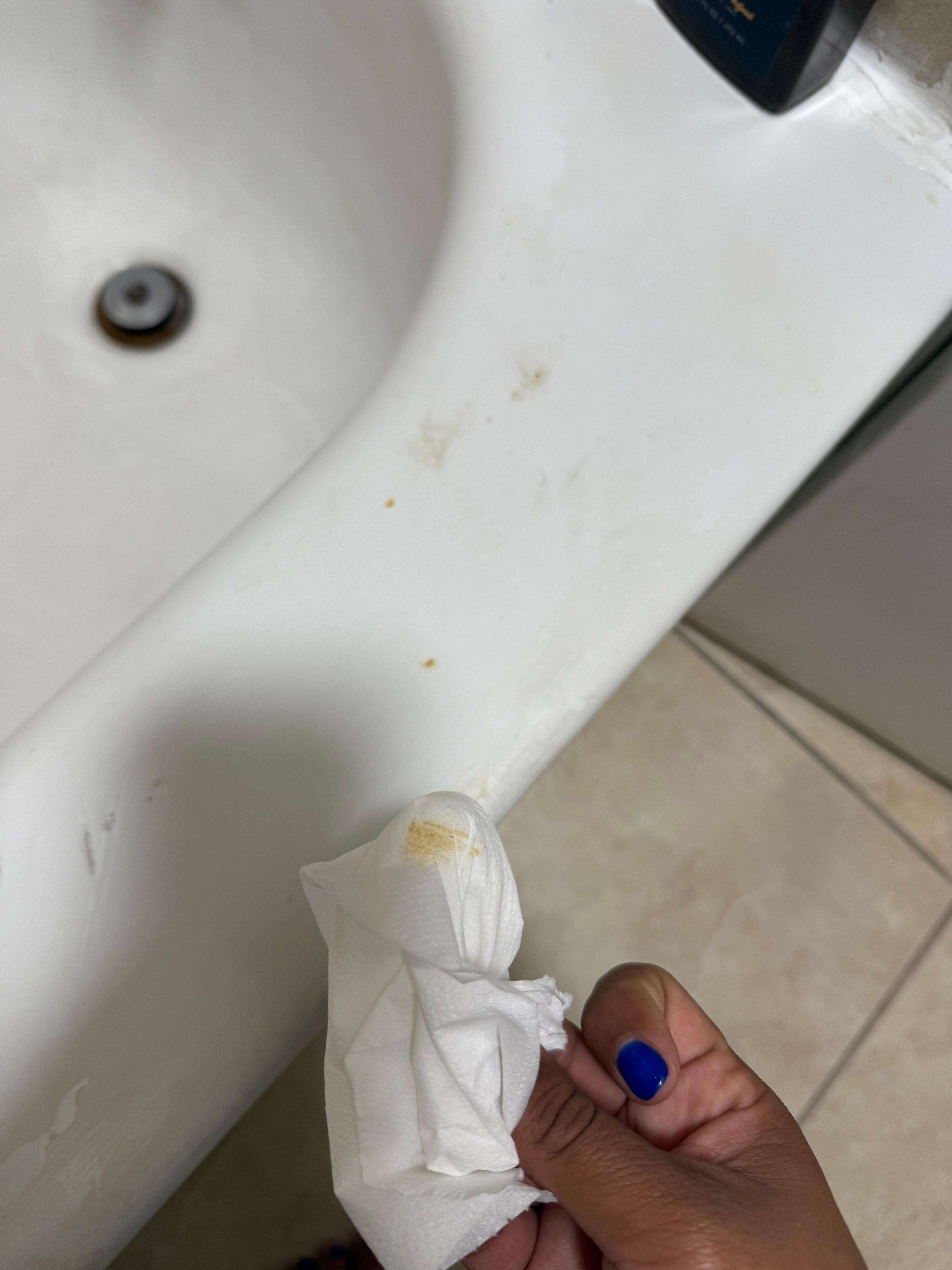 Poop on toilet and bathtub 