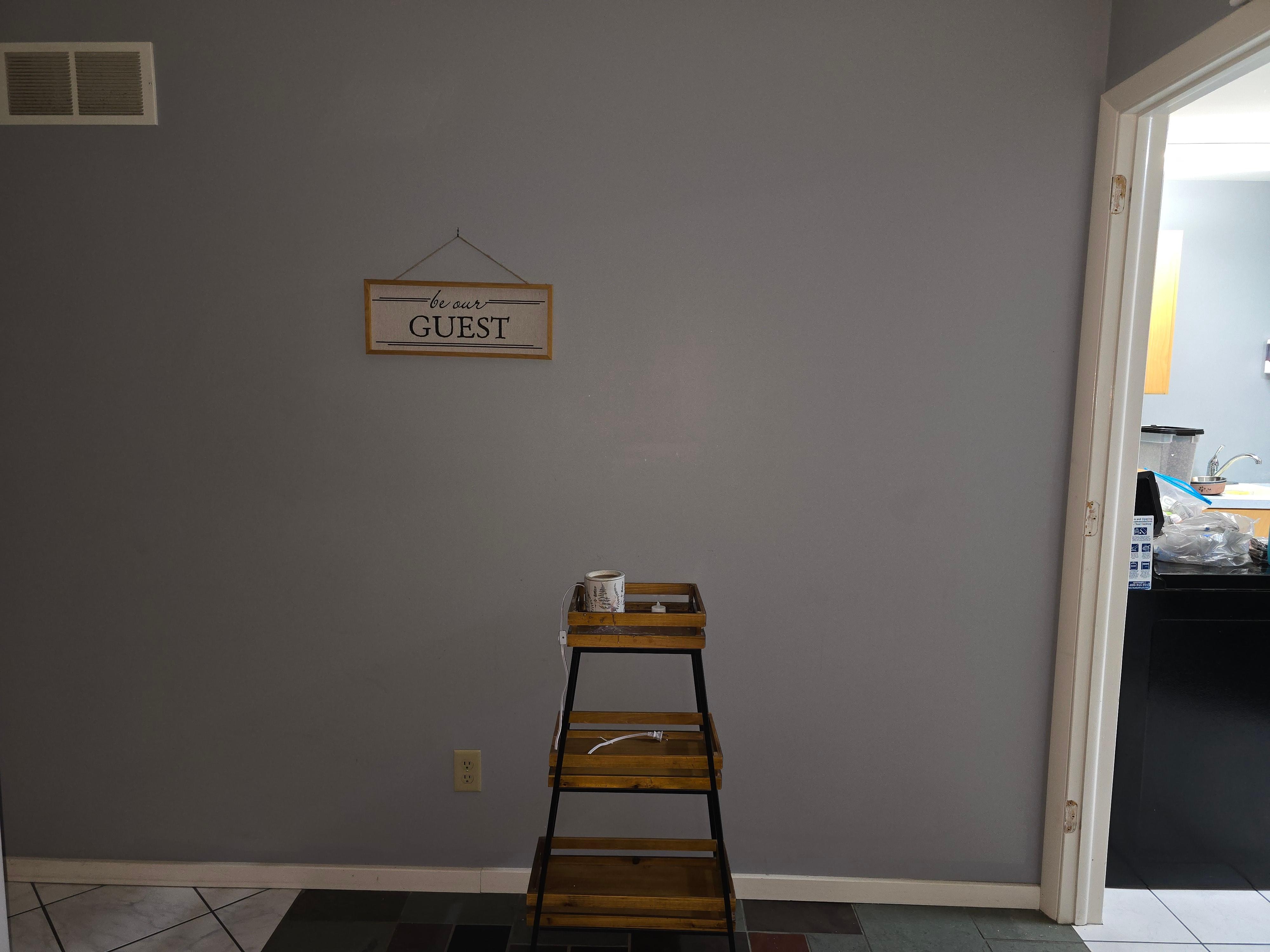 Front entrance. Wax burner and kitchen ti the left