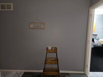 Front entrance. Wax burner and kitchen ti the left