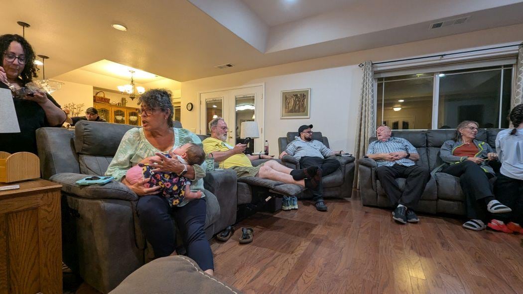 family gathered in family room waiting for game to start